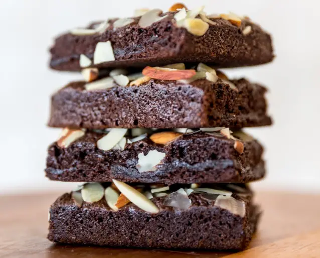 The Impossible Easy Keto & Paleo Avocado Brownie Recipe Topped with Almonds