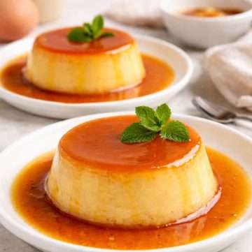 Filipino leche flan served on white plates, showing smooth, dense custard with glossy caramel sauce pooling around the edges