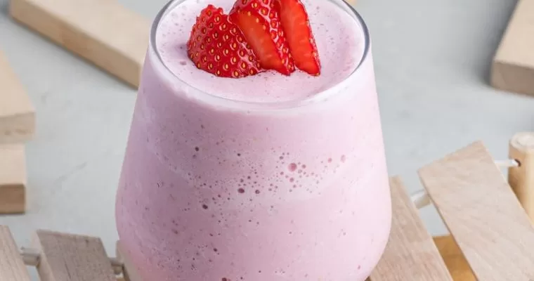 strawberry milkshake with ice cream and milk