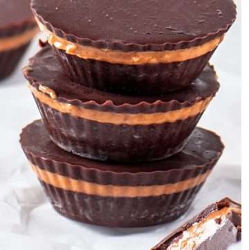 homemade dark chocolate peanut butter cups with creamy peanut butter filling and a smooth chocolate shell.