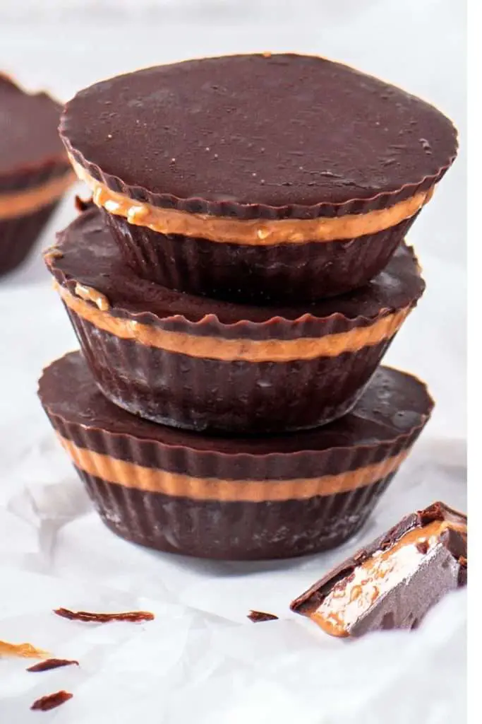 homemade dark chocolate peanut butter cups with creamy peanut butter filling and a smooth chocolate shell.