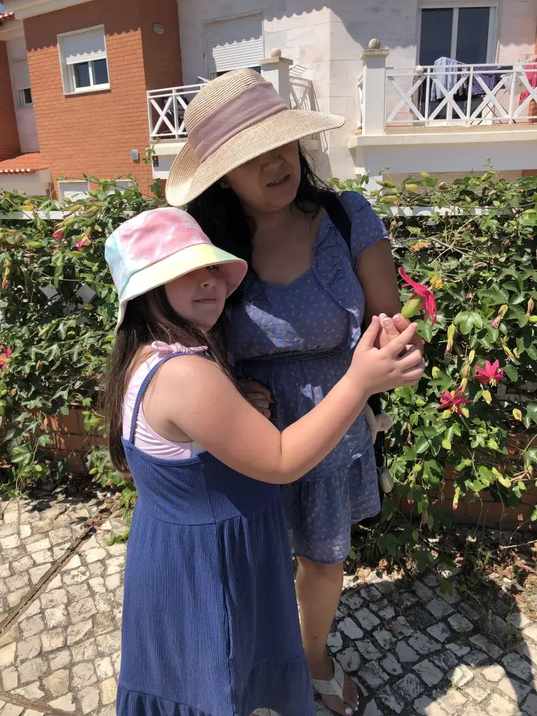 Gina and Camila Picking Flowers