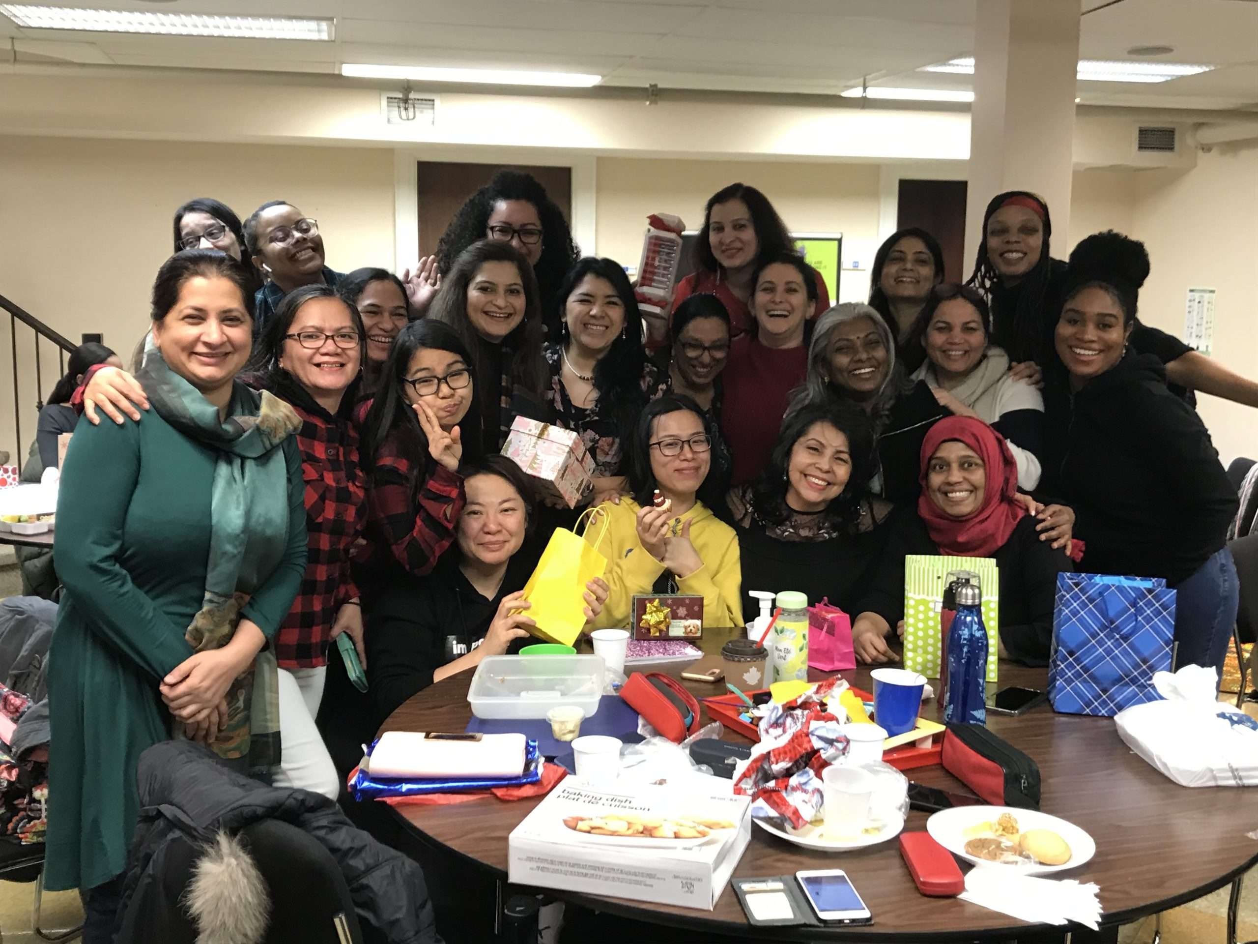 Marcela Arias with classmates at Mothercraft College in Toronto during the holidays, celebrating while studying Early Childhood Education.