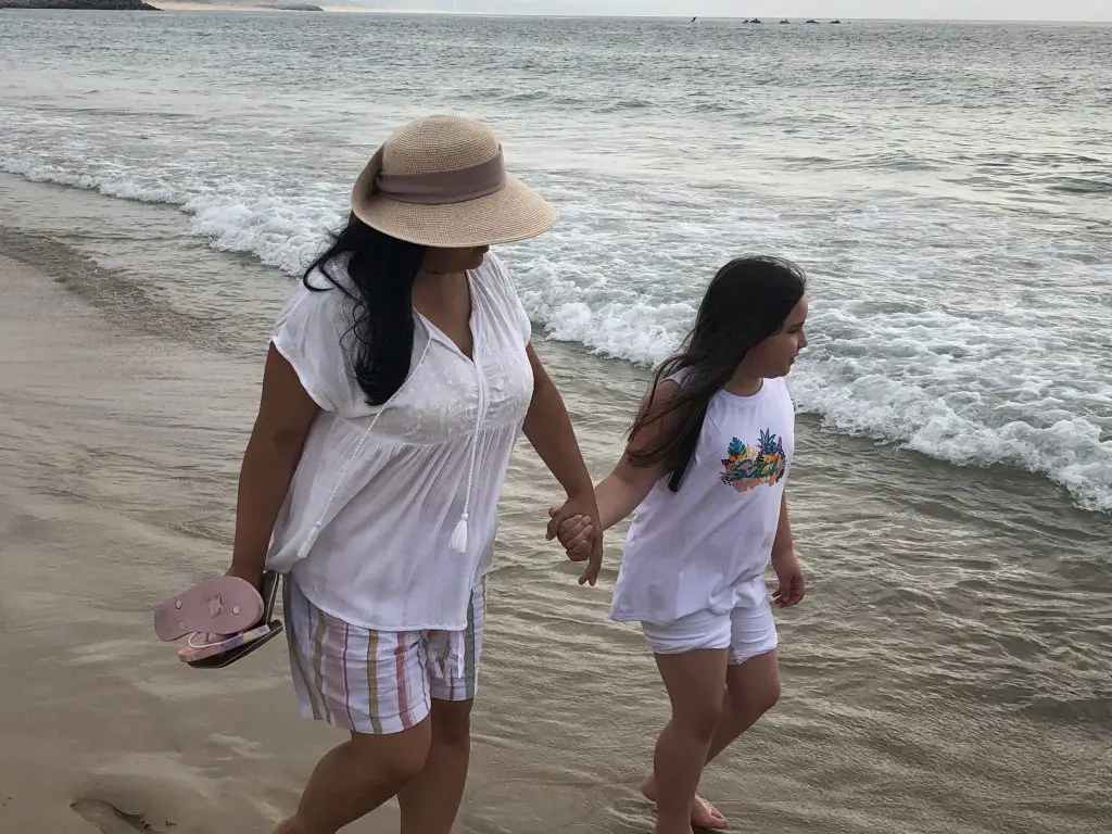 Our vacation in portugal, Camila and I walking longside the beautiful beach