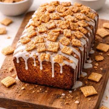 cinnamon toast crunch bread whole loaf topped with vanilla glaze and crunchy cinnamon